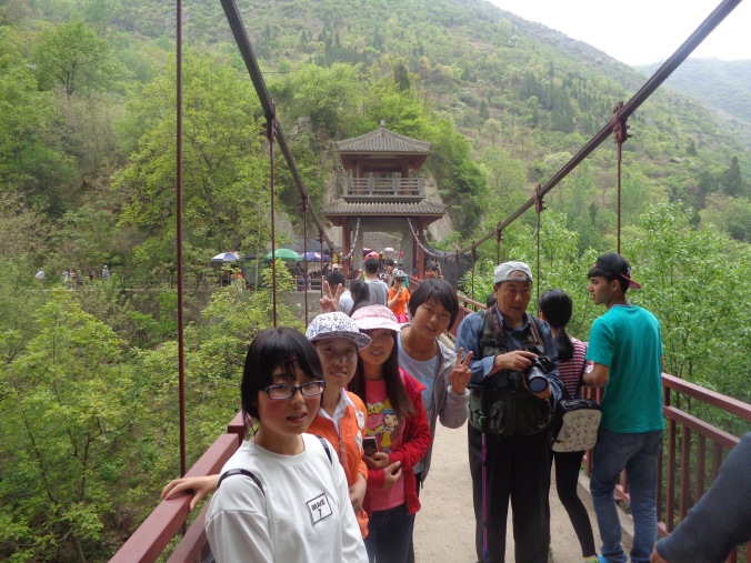 4 peace corps china students on bridge matt christensen
