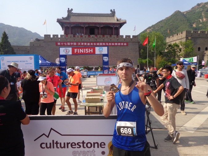 2016 great wall marathon finish 1 person with medal peace corps china luther college matt christensen