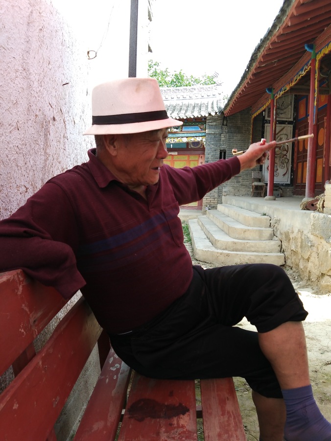 old man with bamboo pipe peace corps china matt christensen